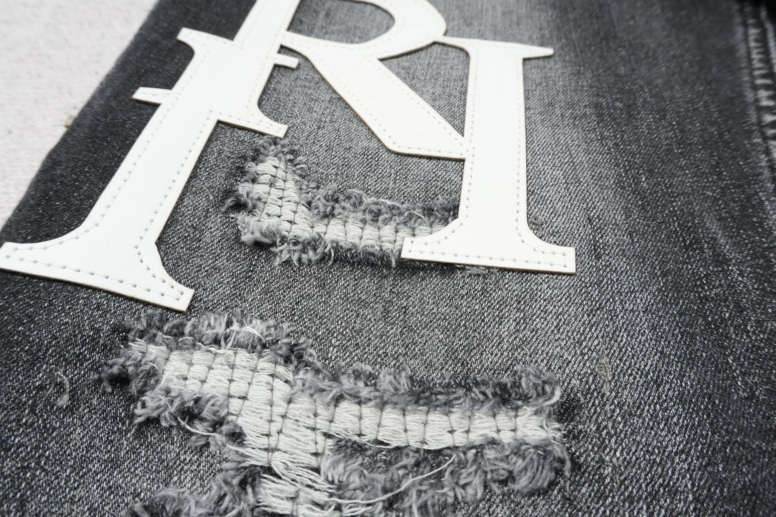 AMIRI BLACK WITH WHITE WRITTING