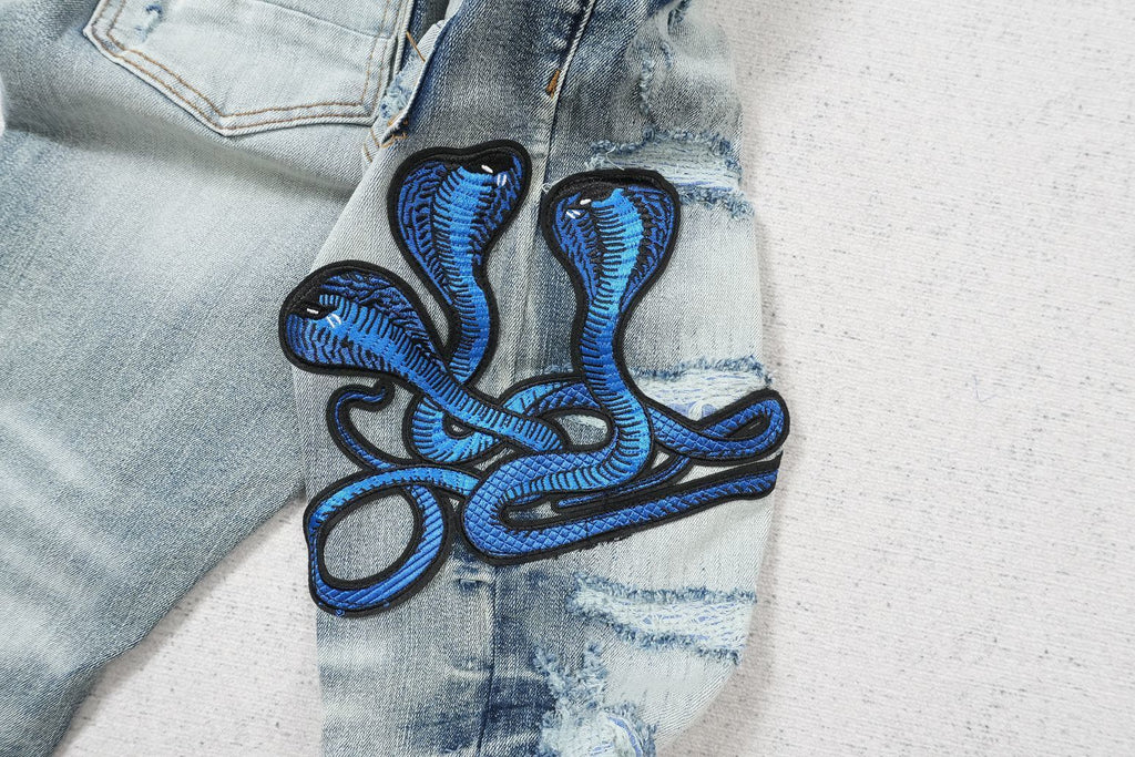 AMIRI CLEAR BLUE SNAKE RIPPED WHITE