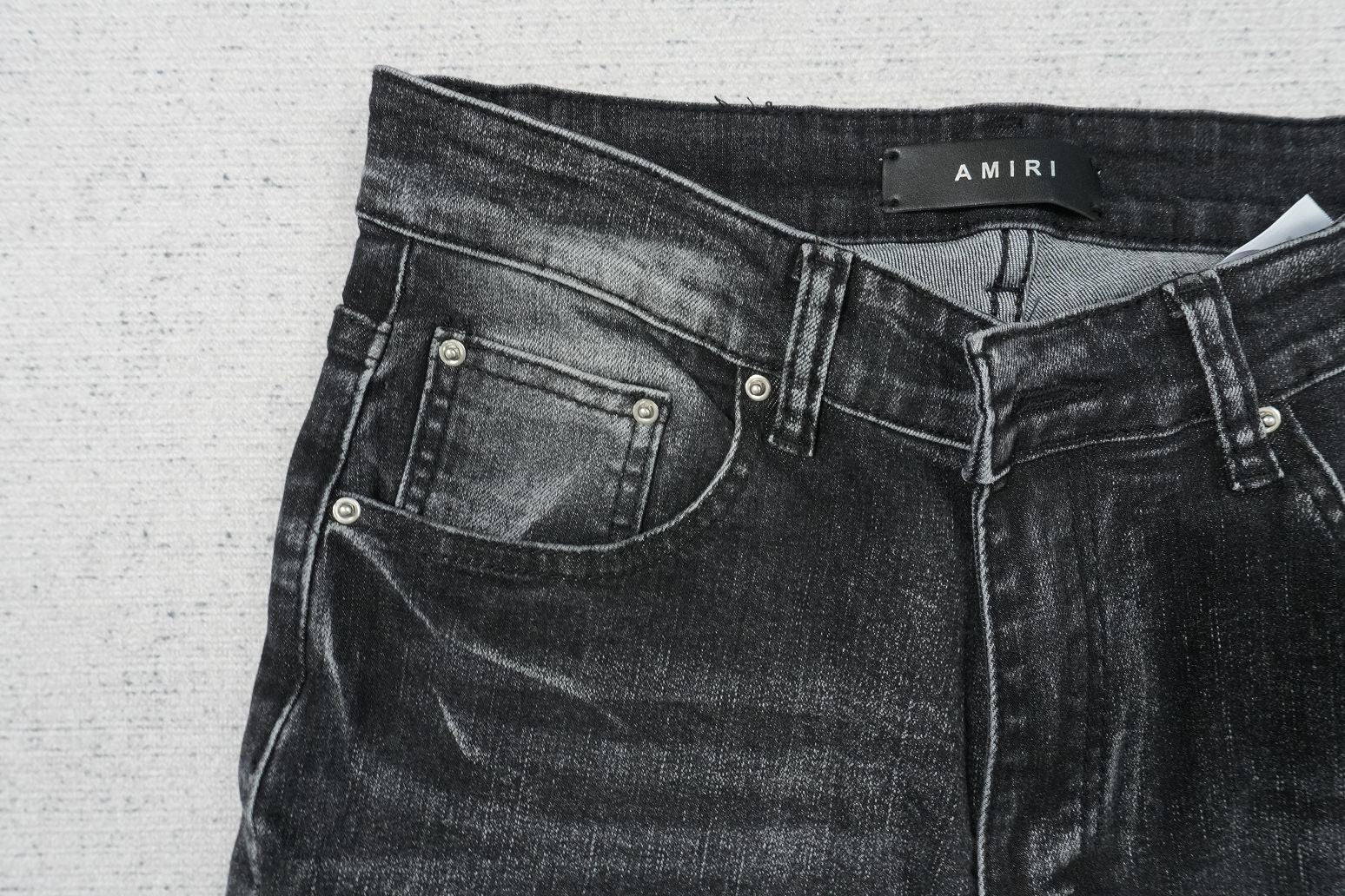 AMIRI BLACK WITH WHITE WRITTING