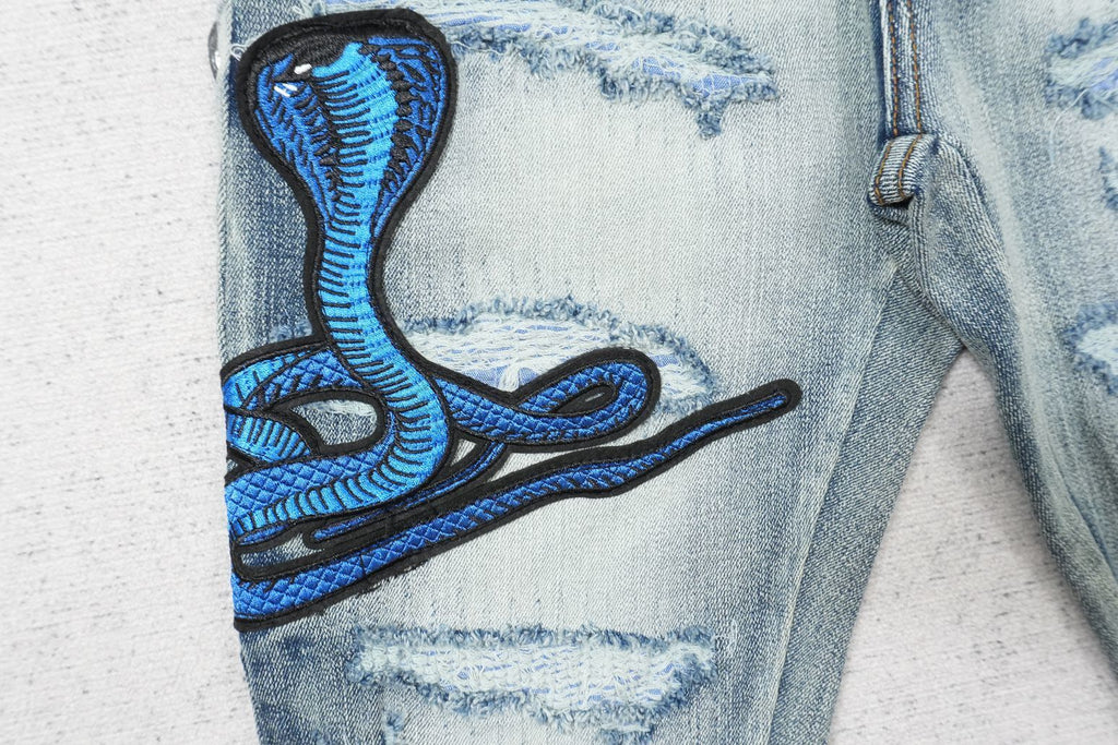 AMIRI CLEAR BLUE SNAKE RIPPED WHITE