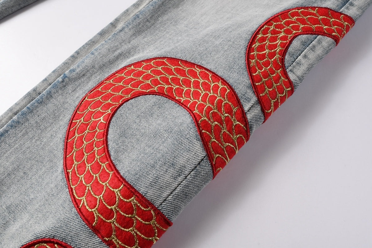 AMIRI RED SNAKE BLUE JEANS