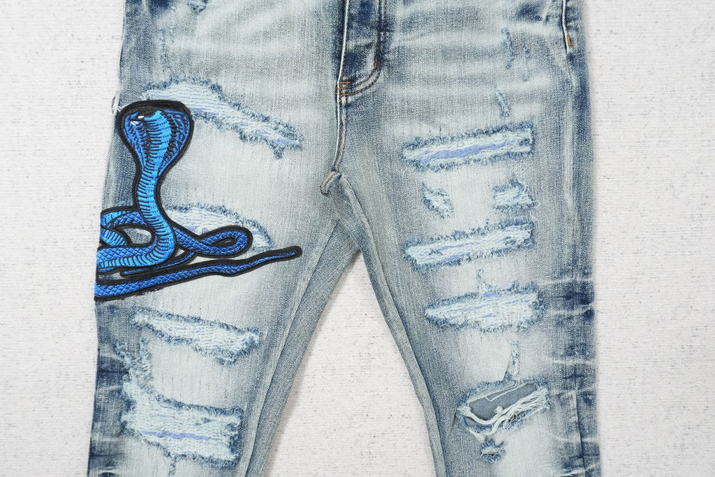 AMIRI CLEAR BLUE SNAKE RIPPED WHITE
