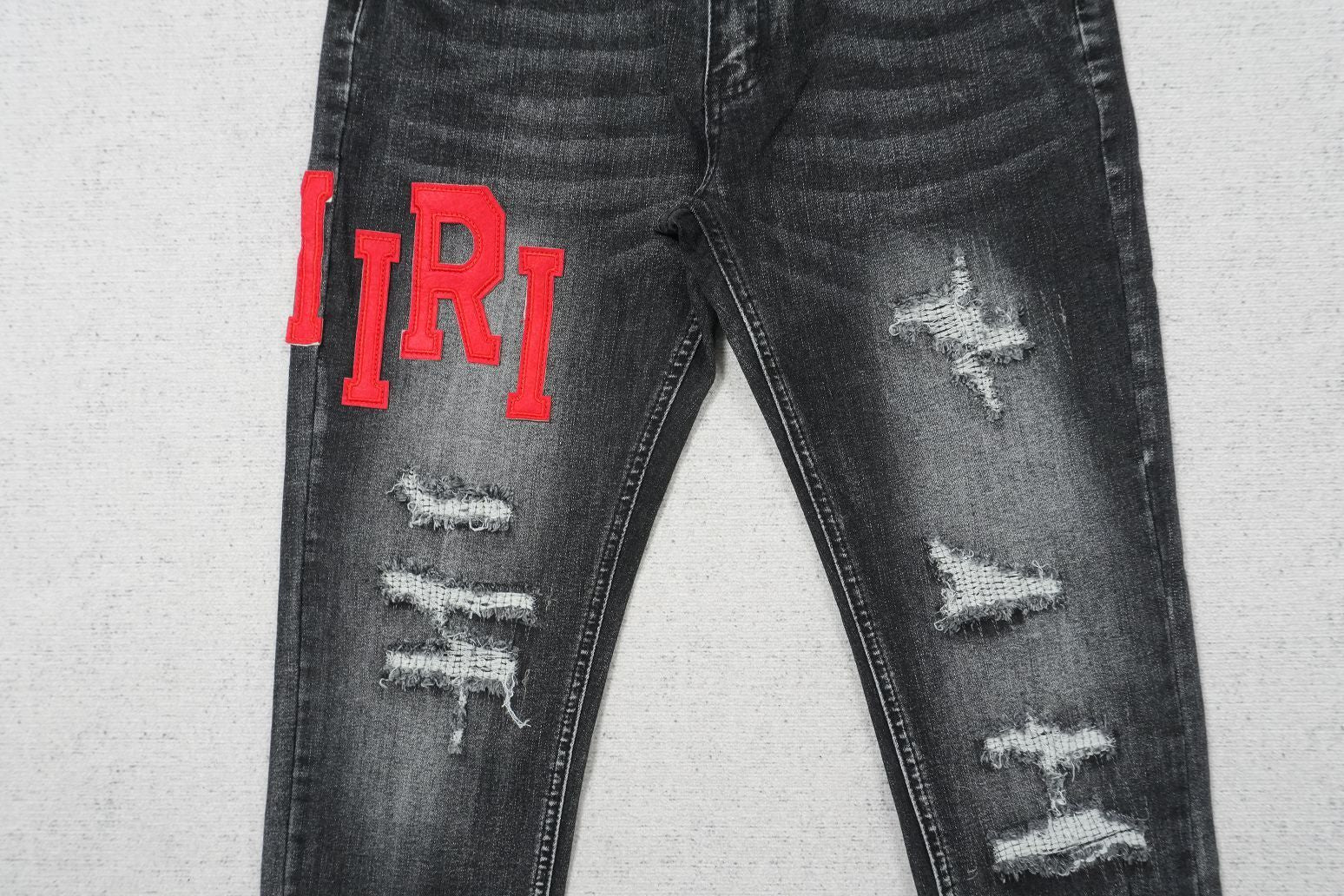 AMIRI BLACK WITH RED WRITTING