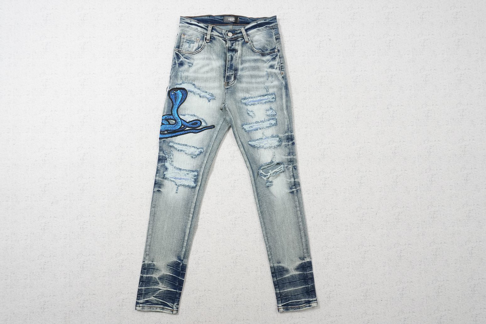 AMIRI CLEAR BLUE SNAKE RIPPED WHITE
