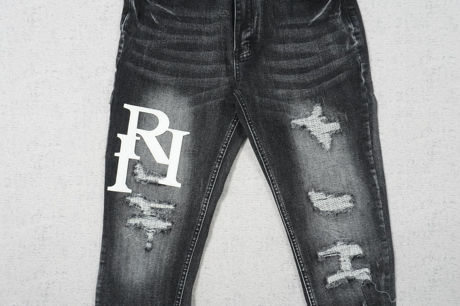 AMIRI BLACK WITH WHITE WRITTING